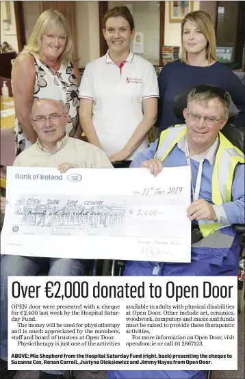  ??  ?? ABOVE: Mia Shepherd from the Hospital Saturday Fund (right, back) presenting the cheque to Suzanne Cox, Ronan Carroll, Justyna Oleksiewic­z and Jimmy Hayes from Open Door.