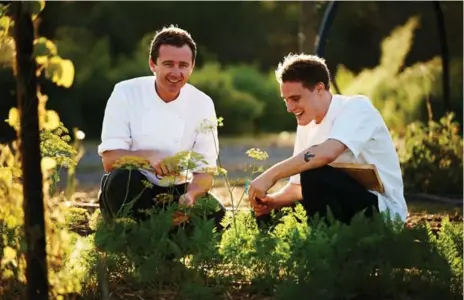  ?? COLIN PAGE ?? Brae’s owner, Dan Hunter, left, alongside sous chef Damien Neylon. The restaurant’s staff spend nearly two hours every day harvesting organic produce.