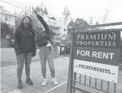  ?? ERIC RISBERG/AP ?? UC Berkeley freshmen Sanaa Sodhi, right, and Cheryl Tugade apartment hunt March 29 in Berkeley, Calif.