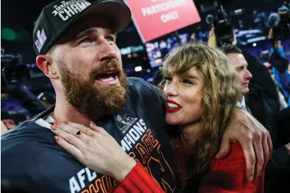  ?? Photograph: Patrick Smith/Getty Images ?? Travis Kelce celebrates with Taylor Swift after the Kansas City Chiefs defeated the Baltimore Ravens on 28 January.