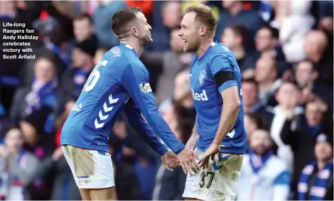  ??  ?? Life-long Rangers fan Andy Halliday celebrates victory with Scott Arfield