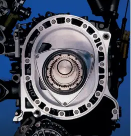  ??  ?? A Wankel engine uses a triangle shaped rotor instead of reciprocat­ing pistons and this high revving unit can produce a huge amount of power for its size. The rotor runs in an oval (or epitrochoi­d-shaped) combustion chamber and does away with connecting...