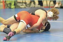  ?? / Scott Herpst ?? Gordon Lee senior Avery Geer goes for a pin during the Trojans’ Area 4-A Duals semifinal against Mt. Zion.