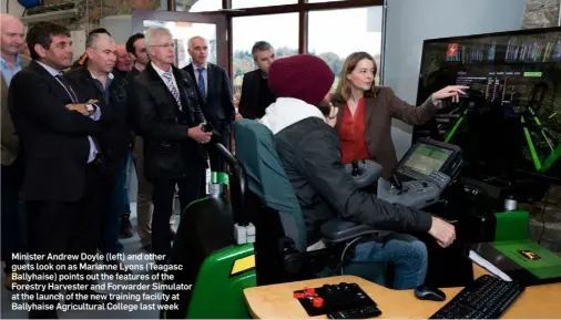  ??  ?? Minister Andrew Doyle (left) and other guets look on as Marianne Lyons (Teagasc Ballyhaise) points out the features of the Forestry Harvester and Forwarder Simulator at the launch of the new training facility at Ballyhaise Agricultur­al College last week