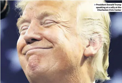  ??  ?? &gt; President Donald Trump speaking at a rally at the Charleston Civic Center