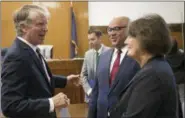  ?? MARY ALTAFFER — THE ASSOCIATED PRESS ?? Manhattan District Attorney, Cyrus Vance, Jr., speaks to Seth Steed, center, Managing Attorney of the Criminal Defense Practice at Neighborho­od Defender Service of Harlem, and Director Carolyn P. Wilson, New York County Defender Services, after a hearing in Manhattan criminal court, Wednesday.