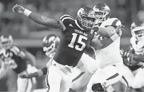  ?? KEVIN JAIRAJ, USA TODAY SPORTS ?? Former Texas A& M defensive end Myles Garrett, left, is considered by most NFL scouts as the No. 1 prospect in this year’s draft.