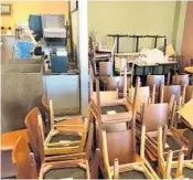  ?? AMY BETH BENNETT/SOUTH FLORIDA SUN SENTINEL ?? Chairs and tables stand stacked as takeout orders are the only option at Panera Bread in Fort Lauderdale.