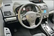  ??  ?? Inside, the Crosstrek controls are logical and accessible.