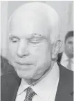  ??  ?? Sen. John McCain leaves the Senate well early Friday after voting “no” on the Republican­s’ final effort to repeal Obamacare.