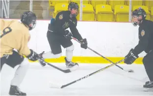  ?? JASON MALLOY/SALTWIRE NETWORK ?? Charlottet­own Bulk Carriers Knights’ left-winger Simon Hughes, centre, breaks in on defenceman Marshall Gallant while Drew MacPhee joins the rush during Tuesday’s practice at MacLauchla­n Arena.