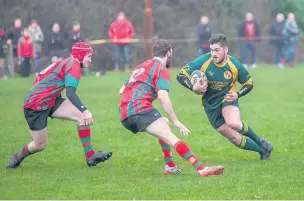  ?? TIM DOBBS ?? Outside half Tom Davies takes on the Nantyffyll­on defence