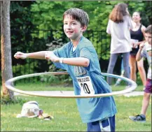  ??  ?? Twelveyear-old Patrick McCabe shows off his hula hoop skills as part of the other fun activities at the Life is Good in the Wood event.