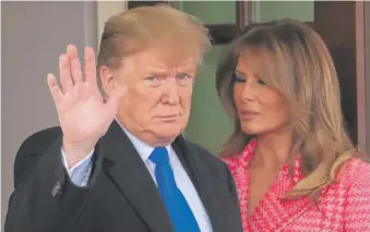  ?? MANUEL BALCE CENETA/AP ?? President Donald Trump, with first lady Melania Trump, waves to reporters outside the West Wing of the White House on Wednesday.