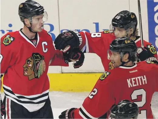  ??  ?? The Hawks’ finances may pressure them into a rebuild, which could mean they say goodbye to Jonathan Toews (left), Patrick Kane (rear) and/or Duncan Keith. NAM Y. HUH/AP