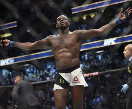  ?? HANS GUTKNECHT, LOS ANGELES DAILY NEWS VIA THE ASSOCIATED PRESS ?? Jon Jones reacts after knocking out Daniel Cormier during UFC 214 in Anaheim, Calif., on Saturday.