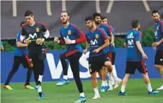  ?? AP ?? Spain’s goalkeeper David De Gea (centre) along with his teammates takes part in a training session in Krasnodar, Russia ahead of their final group match against Morocco.