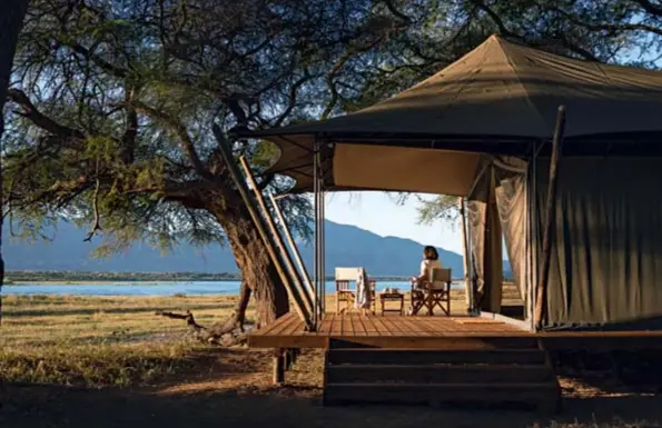  ??  ?? Ruckomechi Camp has gorgeous views of the mighty Zambezi River and the Zambian foothills in the distance.