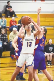  ?? Pete Paguaga / Hearst Connecticu­t Media ?? Housatonic’s Sydney Segalla goes up for a shot against Nonnewaug during the Berkshire League semifinals at Northweste­rn high school on Tuesday night.