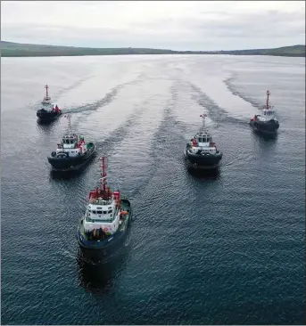  ??  ?? „ Two new tugs arrive in Scapa Flow, escorted by the three currently in service. Photograph: Colin Keldie