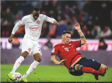  ??  ?? hat-trick...niklas sule and his Bayern Munich team-mates struggled to find a way to stop Fortuna dusseldorf’s dodi lukebakio (left)