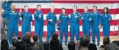  ?? David J. Phillip / Associated Press ?? Astronauts assigned to crew the first flight tests and missions of the Boeing CST-100 Starliner and SpaceX Crew Dragon give a thumbs-up after NASA introduced them Aug. 3 in Houston.