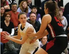  ??  ?? LOOKING TO PASS: Latin Academy's Nellie Conklin (left) looks to pass by Watertown's Taylor Lambo.