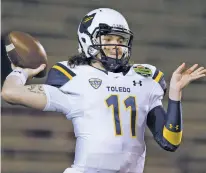  ?? ASSOCIATED PRESS FILE PHOTO ?? The Rockets certainly should have an explosive offense. Quarterbac­k Logan Woodside, pictured, returns after throwing 45 touchdown passes to lead all FBS players last season.