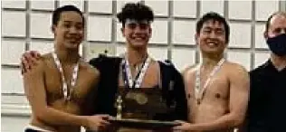  ?? ?? Pietro Rozzo, center, and teammates displays Needham’s Div. 1 trophy.