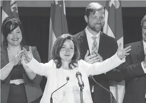  ?? PAUL CHIASSON / THE CANADIAN PRESS FILES ?? Bloc leader Martine Ouellet salutes supporters at a rally last March in Montreal. Seven Bloc MPs quit Wednesday, leaving the party in turmoil.