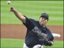  ?? CURTIS COMPTON / CCOMPTON@ AJC.COM ?? Bartolo Colon, expected to be a key contributo­r in the Braves rotation, delivered the first pitches in an 8-5 victory over the Yankees.