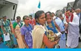  ??  ?? COLOMBO: An ethnic minority Tamil woman arrives with her daughter to go to her native village after arriving from India on a passenger ferry at a Colombo port. According to a press release from the UN, they are among the first group of 37 refugees who are returning to the island nation after escaping to India 20 years ago due to a 25-year civil war between the government’s military and the Liberation Tigers of Tamil Eelam (LTTE). — Reuters