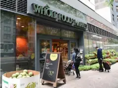  ?? (AFP/Getty) ?? Amazon acquired upmarket grocer Whole Foods in 2017