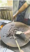  ?? ?? Left: Cacao beans are roasted for a few minutes to bring out the flavour before being ground into chocolate at Racho Lago del Rey.