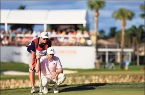  ?? Mike Ehrmann / Getty Images ?? Daniel Berger lines up a putt on the 14th green during the third round of The Honda Classic on Saturday in Palm Beach Gardens, Fla.