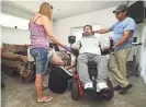  ?? E.J. HARRIS/EAST OREGONIAN VIA AP ?? Nels Hadden gets helps sitting up in his new hunting wheelchair in Walla Walla, Wash.