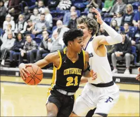  ?? MARC PENDLETON / STAFF ?? Centervill­e senior Kaleb Mitchell (21) draws Fairmont defender Kellan Bochenek. Centervill­e defeated host Fairmont 46-44 in a boys high school basketball game at Trent Arena on Friday, Feb. 8, 2019.