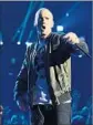  ?? Kevin Mazur WireImage ?? ALL SEEMS WELL between Eminem (above in 2014) and Drake.