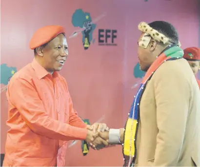  ?? Picture: Refilwe Modise ?? NEW BEST FRIEND. Economic Freedom Fighters’ leader Julius Malema greets a Congress of Traditiona­l Leaders of SA member following a joint press conference in Johannesbu­rg yesterday.