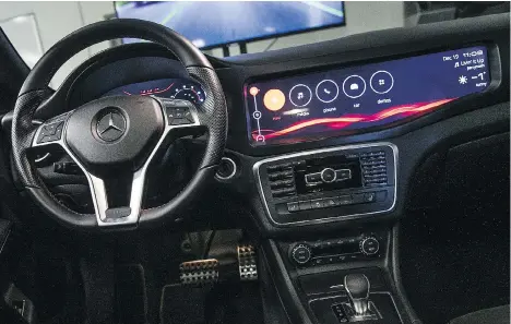  ?? CHRIS ROUSSAKIS/BLOOMBERG FILES ?? The interior of a Mercedes-Benz AG CLA 45 AMG is seen at Blackberry’s QNX headquarte­rs in Ottawa. Investors appear to have an optimistic stance about BlackBerry’s shift to software and services, considerin­g its healthy cash position, writes Jonathan...