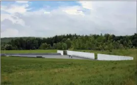  ?? GENE J. PUSKAR — THE ASSOCIATED PRESS ?? In this May 31, 2018photo, visitors to the Flight 93National Memorial visit the Wall of Names containing the names of the 40passenge­rs and crew of United Flight 93 that were killed in this field on Sept. 11, 2001. Later this year, the remaining...