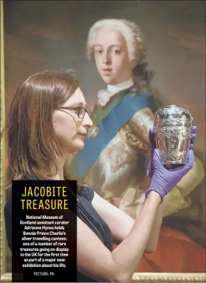  ??  ?? National Museum of Scotland assistant curator Adrienne Hynes holds Bonnie Prince Charlie’s silver travelling canteen, one of a number of rare treasures going on display in the UK for the first time as part of a major new exhibition about his life.