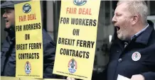  ?? |
AP ?? A union member protests outside Britain’s Department of Transport headquarte­rs calling for new cross Channel ferries to be crewed by UK workers in London.