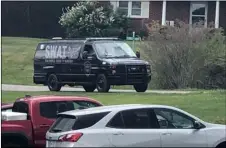  ?? Morgan Frances/WJZY via AP ?? In this photo provided by WJZY, a tactical van from Caldwell County, North Carolina, sits on stand-by at a staging area in Boone, N.C., on on Wednesday.