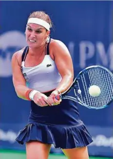  ?? Clint Egbert/Gulf News ?? Dominika Cibulkova hits a double-fisted backhand return to Russia’s Ekaterina Makarova yesterday.