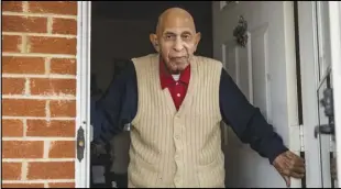  ?? KENDALL WARNER/THE NEWS & ADVANCE VIA AP ?? Alfred Farrar, a Tuskegee Airman, poses for a portrait in the doorway of his home on Dec. 9 in Lynchburg, Va.