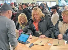  ?? CHRIS CHRISTO PHOTOS / HERALD STAFF ?? TOUGH DECISIONS: Customers, above, choose from the variety of products offered at Cultivate, top.