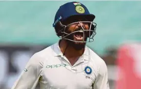  ??  ?? Ravindra Jadeja celebrates scoring century in Rajkot yesterday. AFP PIC