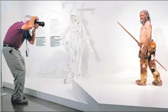  ??  ?? A reconstruc­tion of Otzi the Iceman in South Tyrol Museum of Archaeolog­y in Italy