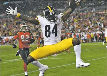  ?? AP/JASON BEHNKEN ?? Pittsburgh Steelers wide receiver Antonio Brown (84) celebrates after his 27-yard score against the Tampa Bay Buccaneers Monday during the first half of an NFL football game in Tampa, Fla.